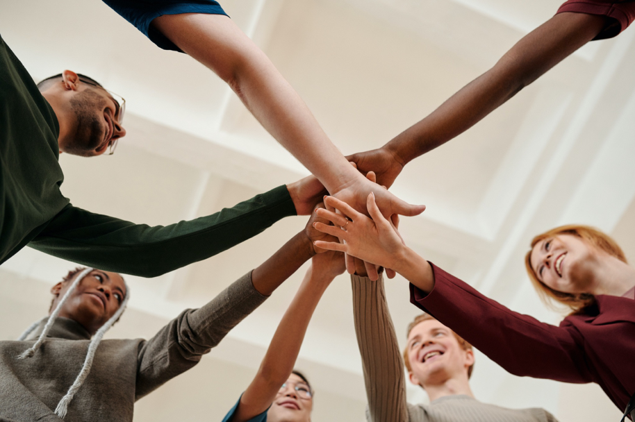 Fractional compensation resources team members in a group huddle